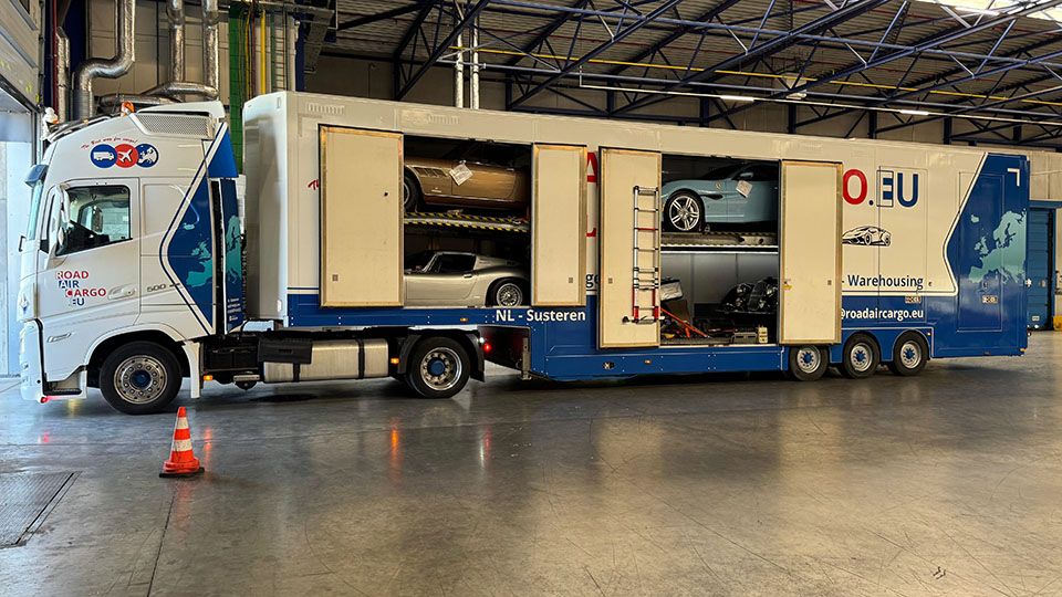 Car transport trailer loaded with exclusive cars