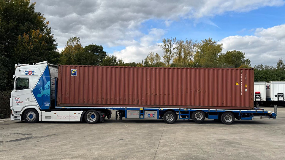 Truck loaded with sea container