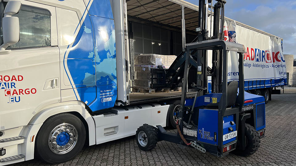 Truck mounted forklift loading unloading